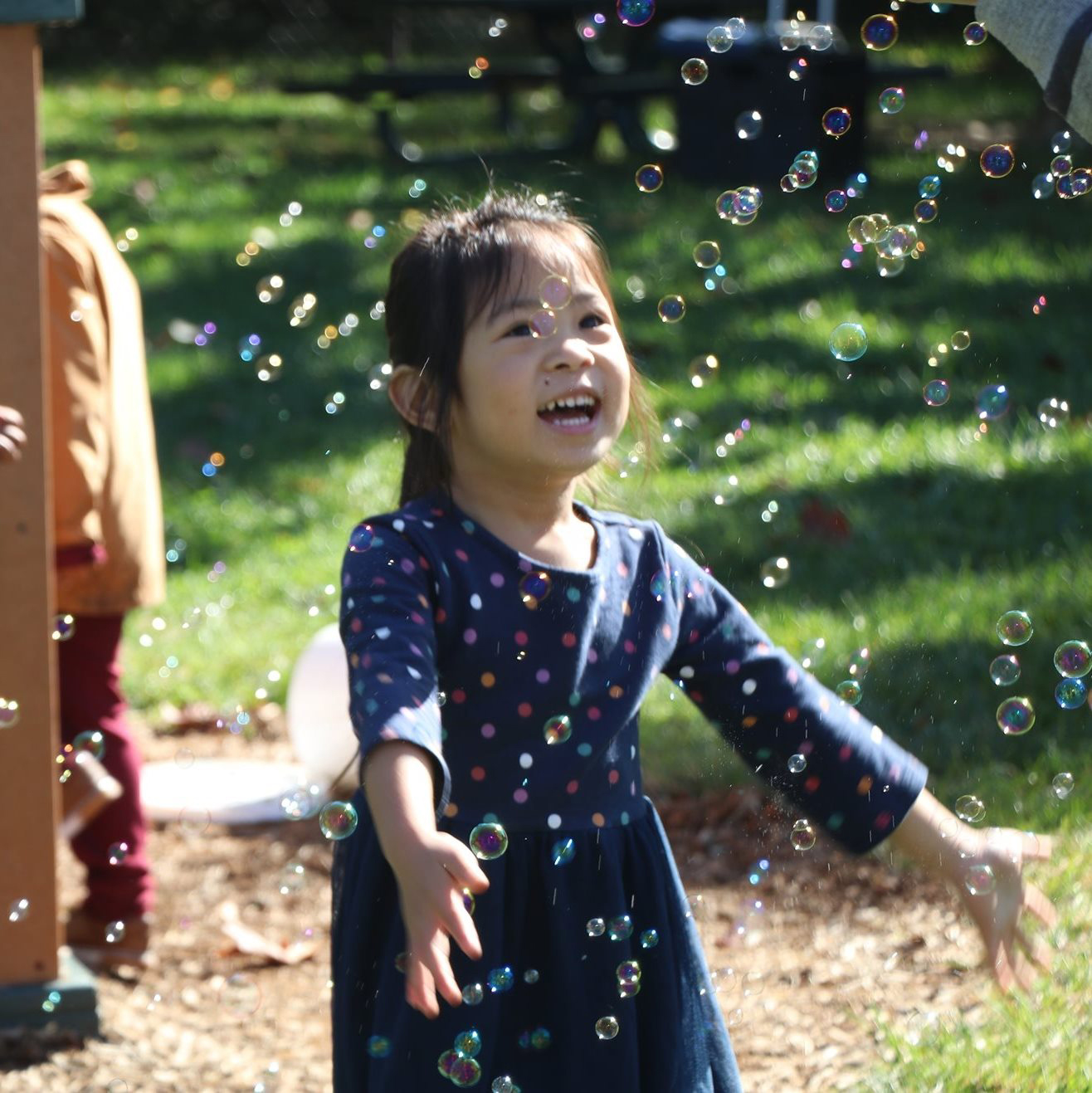 Preschool girl with bubbles