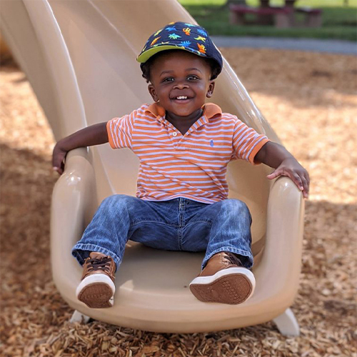 Child on slide at the Early Learning Center