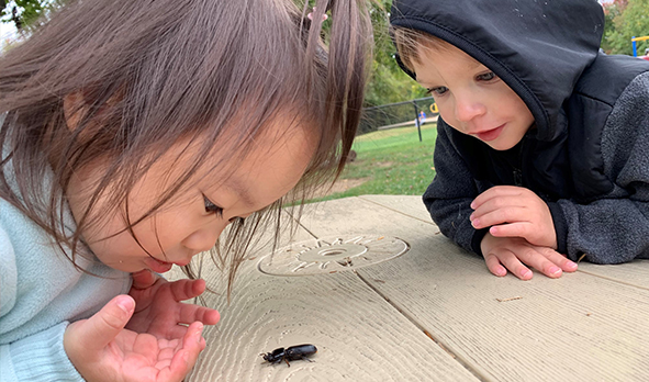 Two toddlers outside at the Early Learning Center